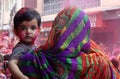 Portrait of Hindu woman and child celebrating Holi festival