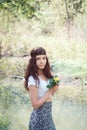 Portrait of hippie girl in forest with flowers Royalty Free Stock Photo