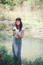 Portrait of hippie girl in forest with flowers Royalty Free Stock Photo