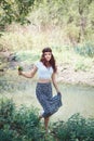 Portrait of hippie girl in forest with flowers Royalty Free Stock Photo