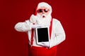 Portrait of his he attractive amazed stunned fat white-haired Santa holding in hands ebook gadget pout lips sale