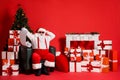 Portrait of his he attractive funky fat overweight cheerful cheery amazed Santa sitting in armchair reading long letter