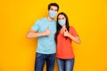 Portrait of his he her she attractive couple guy lady embracing showing thumbup wearing gauze safety mask stop mers cov