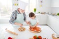 Portrait of his he her she focused grey-haired grandparent grandchild teaching cook homemade vegs vegetarian pizza