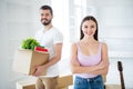 Portrait of his he her she nice attractive cheerful glad confident couple packing belongings carrying fresh start at new