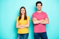 Portrait of his he her she nice attractive lovely charming cheerful cheery content couple entrepreneurs team folded arms