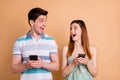 Portrait of his he her she nice attractive pretty lovely cheerful cheery glad couple using digital device spending free Royalty Free Stock Photo