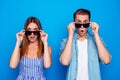 Portrait of his he her she two nice attractive trendy cheerful cheery amazed impressed people touching sun specs looking Royalty Free Stock Photo
