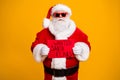 Portrait of his he nice attractive bad Santa disguise hardened criminal holding in hands red board wanted search seeking Royalty Free Stock Photo