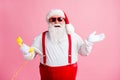 Portrait of his he nice attractive cheerful cheery glad Santa father talking on yellow phone contact center Royalty Free Stock Photo