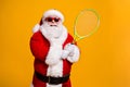 Portrait of his he nice attractive confident cheerful cheery experienced Santa enjoying playing badminton team cup Royalty Free Stock Photo