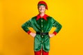 Portrait of his he nice attractive content glad cheerful cheery funny teenage guy elf Eve Noel tradition hands on hips Royalty Free Stock Photo