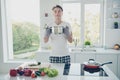 Portrait of his he nice attractive cute dreamy guy housekeeper smelling aromatic useful bouillon making snack lunch at