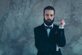 Portrait of his he nice attractive well-dressed serious experienced focused bearded guy wearing tux thinking isolated