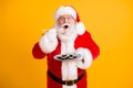 Portrait of his he nice cheerful funny hungry white-haired Santa enjoying eating domestic sushi sashimi roll maki weight