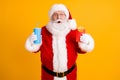 Portrait of his he nice cheerful stunned amazed funny white-haired Santa eating fastfood menu recipe meal dish sale