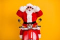 Portrait of his he nice funny amazed stunned wondered cheerful Santa riding moped December tradition omg reaction