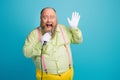 Portrait of his he nice funny cheerful cheery glad bearded man singing karaoke having fun enjoying isolated over bright Royalty Free Stock Photo