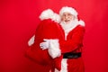 Portrait of his he nice glad cheerful cheery bearded Santa wearing fur coat carrying holding in hands sack holly jolly