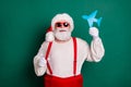 Portrait of his he nice handsome cheerful funky fat overweight Santa holding in hand paper plane shape tour resort Royalty Free Stock Photo