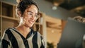 Portrait of Hispanic Creative Young Woman Working on Laptop in Bright Busy Office. Female Manager Royalty Free Stock Photo