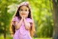 Portrait of hispanic girl in sunny park