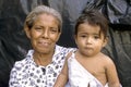 Portrait of hispanic grandma with mobile grandchild