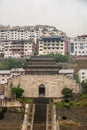Portrait of historic town gate and houses along Yangtze river, Baidicheng, China