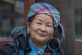 Portrait hmong ethnic woman on the street market in mountain village Sapa, North Vietnam