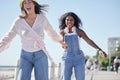 Portrait, holding hands and skate sport girl friends back on outdoor promenade with balance and skating. Woman, skate Royalty Free Stock Photo