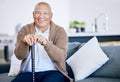 Portrait, home and old man with a smile, walking stick and relax with retirement, peace and calm on a couch. Senior Royalty Free Stock Photo