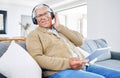 Portrait, home and old man with tablet, headphones and smile with connection, streaming music and radio. Senior person Royalty Free Stock Photo