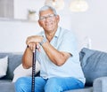 Portrait, home and old man with a walking stick, relax and support with retirement, peace or calm on a couch. Senior Royalty Free Stock Photo