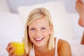 Portrait, home and woman with orange juice, smile and healthy diet with nutrition, relax and wellness. Face, person and