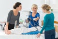 Portrait homecare nurses with hoist Royalty Free Stock Photo