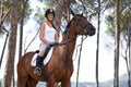 Portrait, horse riding or happy woman in woods or forest with rider or jockey for recreation or adventure. Smile, relax Royalty Free Stock Photo
