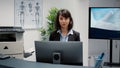 Portrait of hospital reception desk employee working on medical service Royalty Free Stock Photo