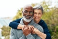 Portrait, hug and senior couple with love, interracial and marriage with happiness, bonding and romance. Face, partners Royalty Free Stock Photo