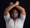 Portrait, human rights and a black woman in protest of domestic violence on a dark background. Freedom, equality or