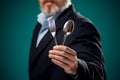 A portrait of hungry man in suit holding spoon and fork Royalty Free Stock Photo