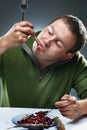 Portrait of hungry man eating fish Royalty Free Stock Photo