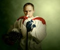 The portrait Ice hockey player on dramatick background Royalty Free Stock Photo