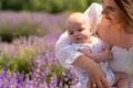 Portrait if a young baby in its mothers arms Royalty Free Stock Photo