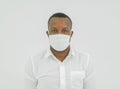 Portrait of ill black american man, African person wearing a face mask for corona virus and health care concept isolated on white Royalty Free Stock Photo