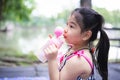 Portrait image Asian child 5 years old. Little kid drinking water with plastics bottle. Children sucking water with tube. Royalty Free Stock Photo