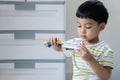 Portrait image of Asian children playing with train. Toddler kid play with blocks, trains and cars Royalty Free Stock Photo