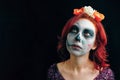 A young woman in day of the dead mask skull face art. Royalty Free Stock Photo