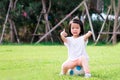 Portrait image of 4 baby kid. Happy Asian child girl sitting on white-blue football. Children gave a thumbs up. Royalty Free Stock Photo