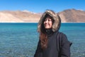 A beautiful Asian woman standing in front of Pangong lake , Ladakh India Royalty Free Stock Photo