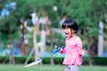 Portrait image child 5 years old. Cute Asian girl having fun playing badminton. Little children enjoy playing outdoor sports. Royalty Free Stock Photo